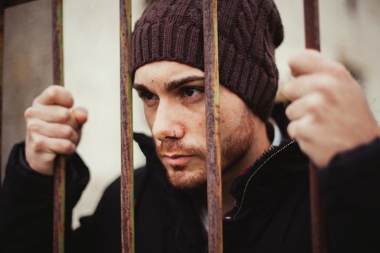 Attractive guy behide the bars