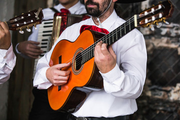 Mexican musicians in the studio, in the interior. Mexico, mariachi, artist, guitarist. 