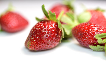 Strawberry fruits in white background.