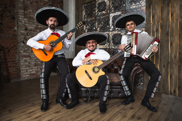 Mexican musicians in the studio, in the interior. Mexico, mariachi, artist, guitarist. 