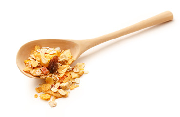 Heap of musli with raisin in wooden spoon