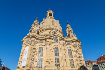 Fototapeta na wymiar Famous Frauenkirche in the city center of Dresden, Germany in the morning sun with blue sky above.