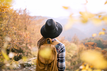 Woman with backpack at viewpoint