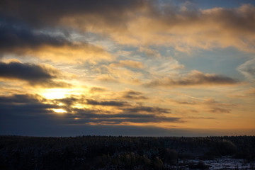Fototapeta na wymiar Sunset over the winter forest