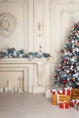 Beautiful holdiay decorated room with Christmas tree and presents under it. New Year decorations