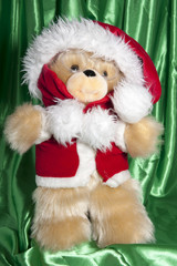 doll with hat of santa claus and gifts