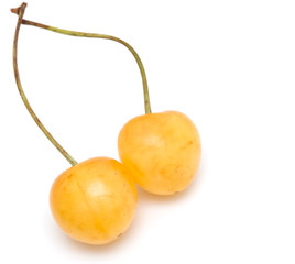 yellow cherries on white background