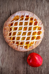 Home baked Lattice apple pie on wooden table