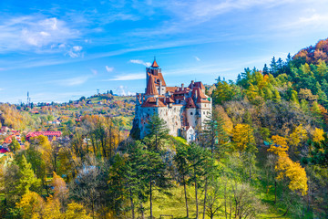 Panoramic view over Dracula medieval Castle Bran in autumn season, the most visited tourist attraction of  Brasov, Transylvania, Romania - obrazy, fototapety, plakaty