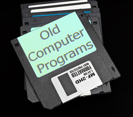 old floppy disks on a black background