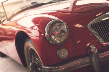 Close up headlight of red Retro classic car