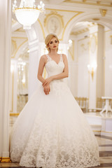 Obraz premium beautiful young woman bride in luxury wedding dress in interior