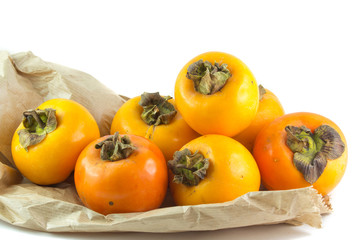 Cachi mela su una borsa di carta