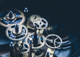 Close view of old clock mechanism with gears and cogs. Conceptual photo for your successful...