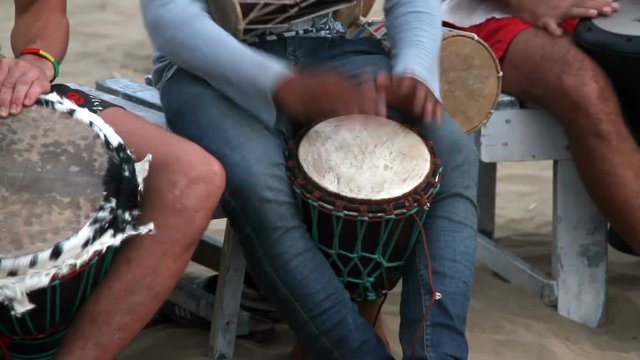 Unidentified man playing on drum 