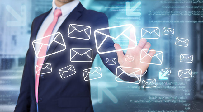 Businessman touching technology interface with email icons