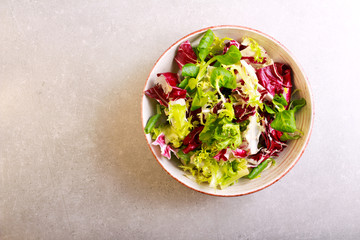 Mix salad leaves and herbs in a bowl