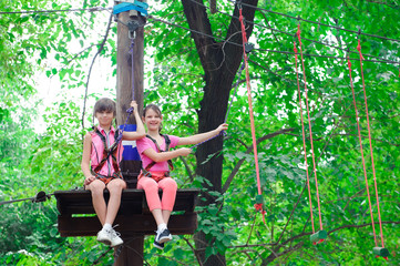 Naklejka na ściany i meble adventure climbing high wire park - hiking in the rope park two