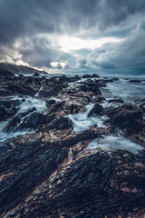 Porthtowan beach in cornwall england UK with the foam on a slow exposure making it look like snow.