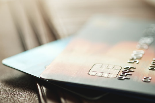 Credit cards on brown wallet in shallow focus