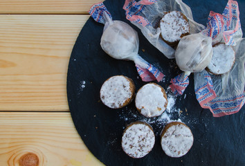 Polvorones, typical  Christmas sweets  in Spain on black stone background. Polvoron is a shortbread cookie / candy.Top view, copy space.