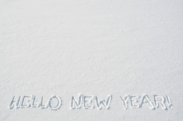 Hello new year text letters handwritten on flat snow surface. Empty space for copy, lettering. New year holiday postcard, greeting card template.