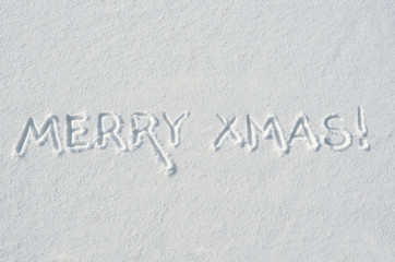 Merry Xmas letters handdrawn on flat snow surface. Nice horizontal holiday postcard, greeting card template. Empty space for copy, text, lettering.