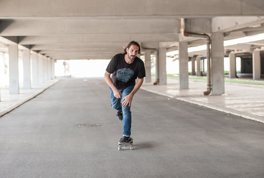 Professional skateboarder in underground passage