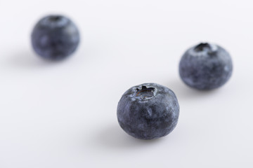 fresh juicy blueberries on white background