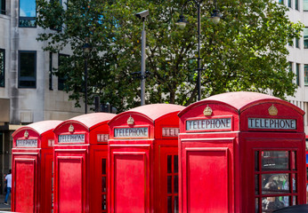 Fototapeta premium Four telephone boxes in London