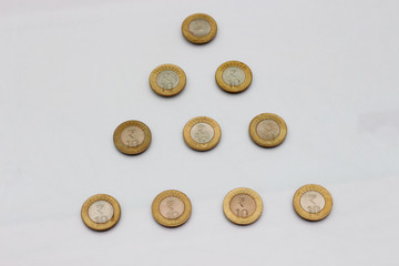 Ten rupee coin of India. Pyramid pattern design.