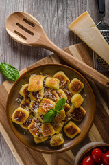 Crispy gnocchi with cheese and herbs