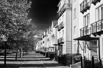 Modern new terraced houses and apartment flats in Cardiff, Wales, UK, black and white image