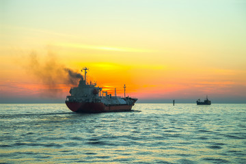 Obraz premium Seascape - LPG Tanker ship at sunrise.