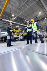 Workers working with aluminium billets