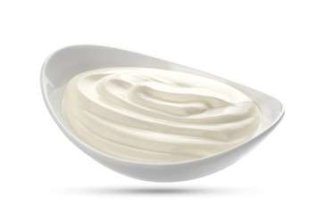 Sour cream in bowl isolated on white background