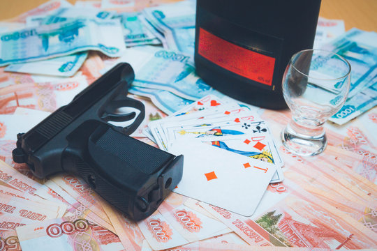 The gun and playing cards Russian big money