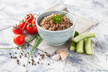 buckwheat cereal and vegetables on a table, selective focus