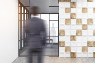 Rear view of a businessman enterting a room with white and wooden tiles on the wall and panoramic windows. 3d rendering.