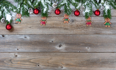 Fototapeta na wymiar Top border of Christmas objects and snow on rustic wooden boards