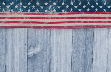USA patriotic old flag on a weathered wood background