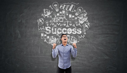 Ecstatic Asian man near success icons