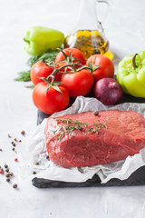 piece of beef and vegetables on a table, selective focus