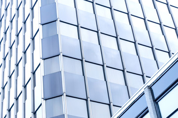 View of a modern glass skyscraper buildings around