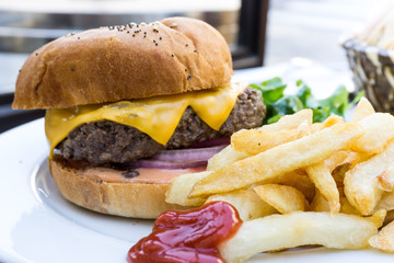 Cheese burger - American cheese burger with Golden French fries