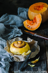 homemade pumpkin cinnamon rolls in rustic style