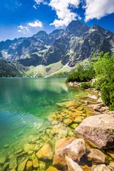 Schilderijen op glas Beautiful pond in the mountains at sunrise in Poland © shaiith