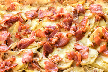 Roasted potato with onion and bacon freshly brought of from the oven.