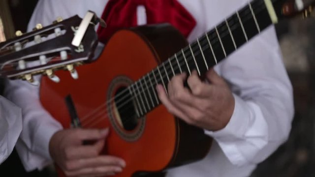 Male musician playing the guitar. Close-up of hands.