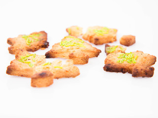 Christmas tree shaped cookies on white background